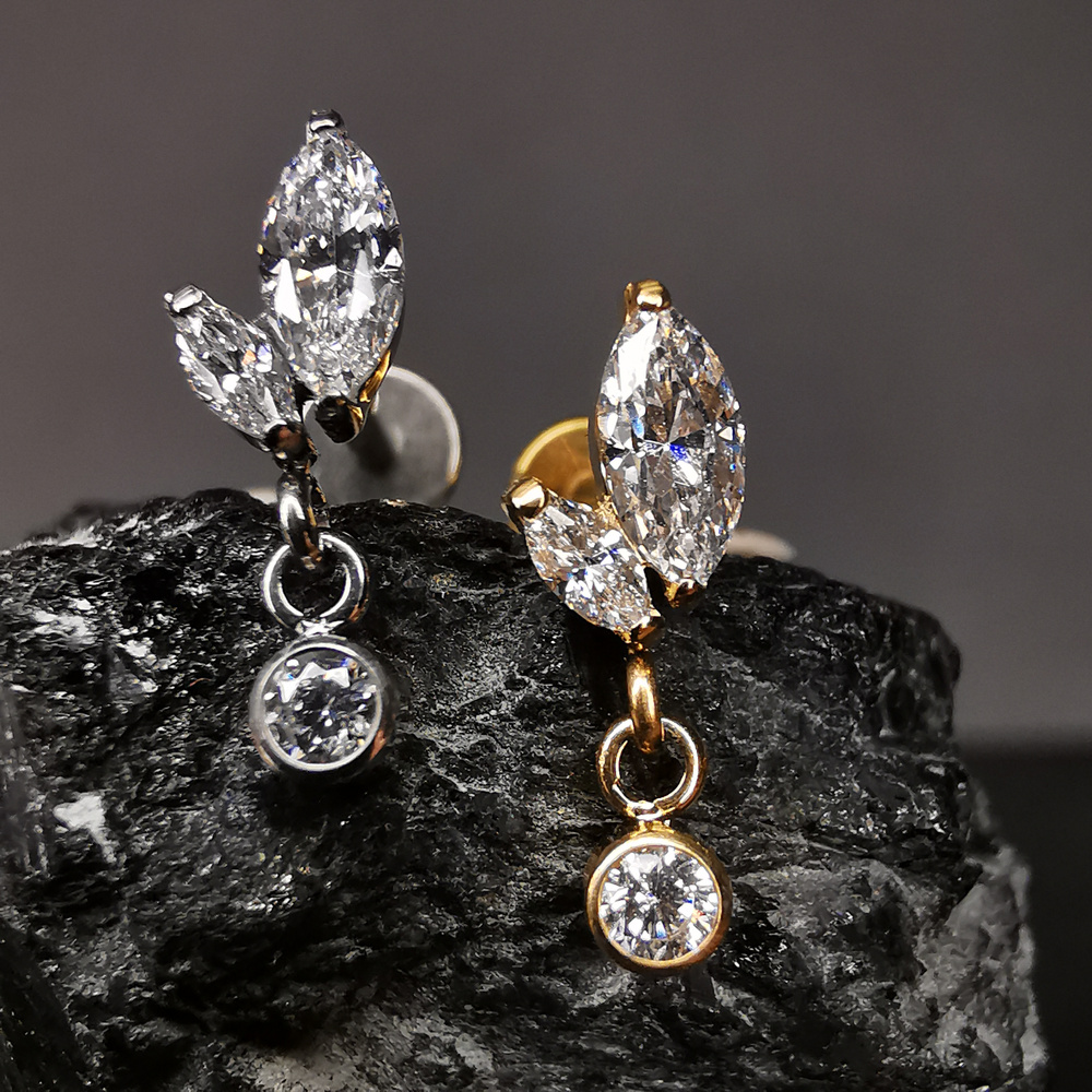 Titanium attachment with white zircons - gold - TNA-028